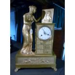 A highly decorative French Empire ormolu figural mantle clock modelled with a lady in Classical