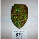 A shield shaped jade pendant with dragon decoration est: £40-£60