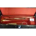 A cased brass trombone and brass music stand boxed est: £40-£60 (E)