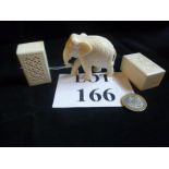 A carved ivory elephant and two carved ivory boxes et: £50-£80 (N1)