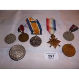 An assortment of various medals to include WWI Victory & Star medal and a Coronation medal 1911