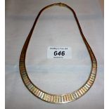 A 9ct gold necklace in three coloured gold est: £200-£300