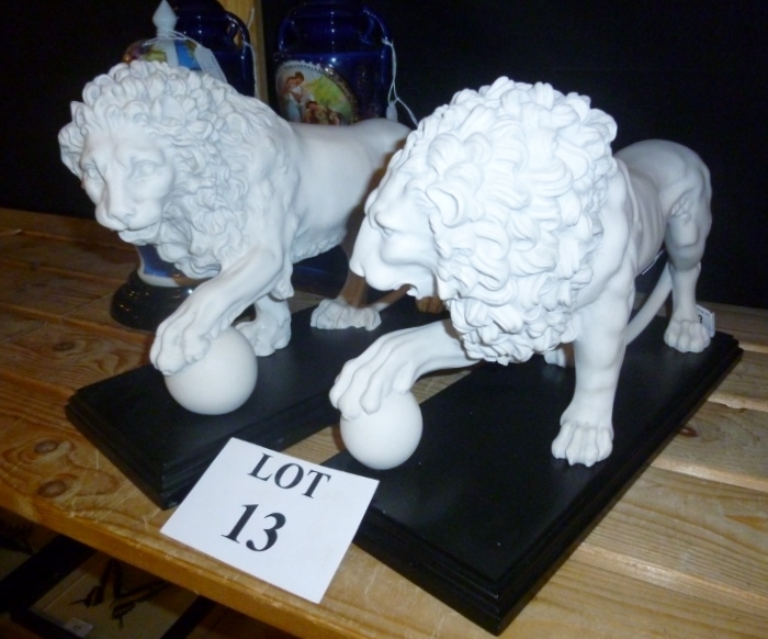 A pair of well carved lions after the Medicci lions on slate plinth bases est: £120-£180 (A2)