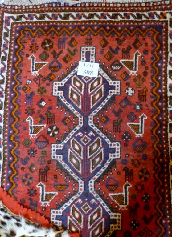 A 20c Persian rug depicting stylised animals (150 x 102 cm approx) est: £50-£80