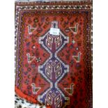 A 20c Persian rug depicting stylised animals (150 x 102 cm approx) est: £50-£80