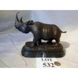 A bronze rhino on a marble stand est: £30-£50 (K1)