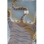 A 20c wool rug depicting a tiger (180 x 90 cm approx) est: £40-£60