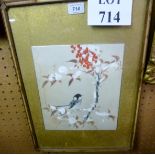 A framed and glazed oriental watercolour study of a bird amongst berry tree leaves signed and