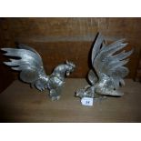 A pair of silver plated fighting cockerel's est: £25-£45 (D1)