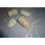 Four large old clay pipes est: £25-£45 (N2)