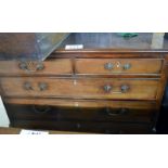 A George III mahogany chest of two short over three long graduated drawers with brass handles and