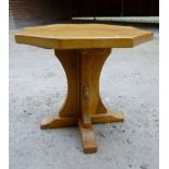 Robert Thompson (Mouseman) - An octagonal pale oak low table (50 cm diameter) bearing the oak mouse