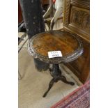 A 19c carved tripod table with spiral twist column est: £40-£60