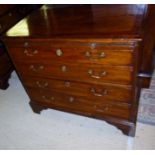 A George III mahogany bachelor's chest with brushing slide over four graduated drawers with brass