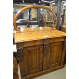 A Victorian pale mahogany arched mirror back chiffonier with two drawers over linen fold carved