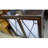 An Edwardian mahogany glazed bookcase with double doors and material backing est: £50-£80