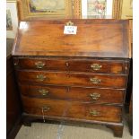 A Georgian mahogany writing bureau with a fitted interior over four long drawers est: £80-£120