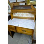 An Edwardian satinwood marble top washstand with original tiles est: £50-£80
