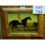 A burr walnut framed and glazed Victorian painting on glass depicting a jockey on horseback est: