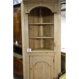 A 19c pine free standing corner cupboard with open shelves over a panelled cupboard est: £80-£120