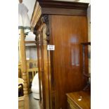 A Victorian mahogany large double wardrobe with shaped cornice over double arch panelled doors and