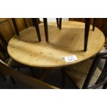 An early 20c pine round kitchen table on triple splayed feet est: £50-£80