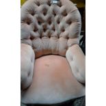 A Victorian deep buttoned armchair with turned legs and white china casters est: £20-£30