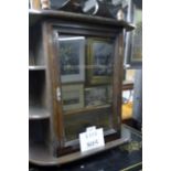 A 20c table top display case with single door and shelves either side est: £20-£30