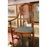 An Arts & Crafts elbow chair with inlaid mother of pearl over peacock upholstery est: £30-£50