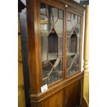 A 19c mahogany corner display cabinet with two astral glazed doors (two panels missing) over double