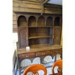 A c1900 oak Welsh dresser with plate rack above drawers good clean condition est: £100-£150
