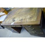 A Victorian mahogany pedestal writing desk with worn top over nine drawers est: £120-£150