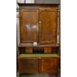 A 19c mahogany secretaire bookcase with adjustable shelves over a pull out writing drawer and