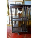 An Edwardian mahogany inlaid revolving book case in good condition est: £60-£80