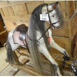 A superb Lyons Bros Ltd dapple grey large rocking horse in good condition and with usual wear and