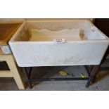 A large Twyford's  white butler's sink (3ft wide approx) and a white enamel shelf est: £50-£100