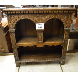 A small free standing oak carved bookcase est: £55-£85