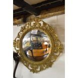 A fine ornate carved convex wall mirror in good condition (87 cm max diameter frame) est: £200-£300