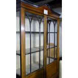 An Edwardian mahogany double door display cabinet with one a/f glass panel and decorated with box