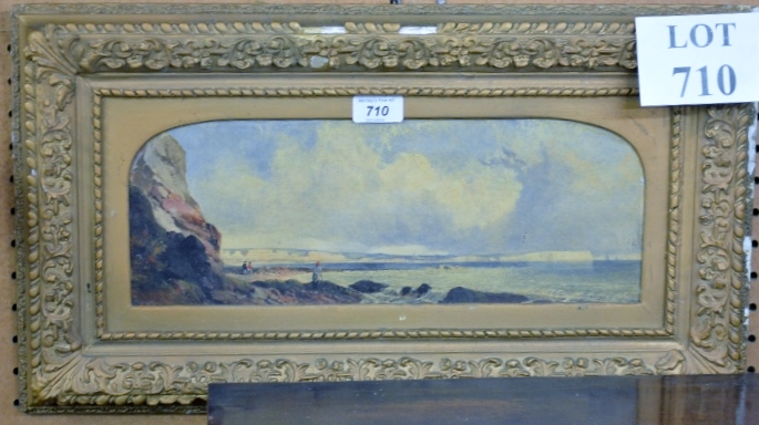 A gilt framed oil on board coastal scene with figures on rocks est: £40-£60