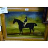 A walnut framed and glazed print on glass depicting a jockey on horseback with information/text