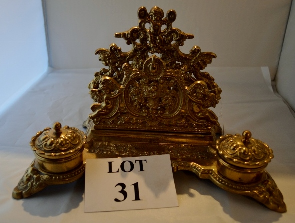 A decorative late 19th century continental rococo brass desk set comprising letter rack and twin