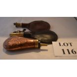 Three old powder flasks,