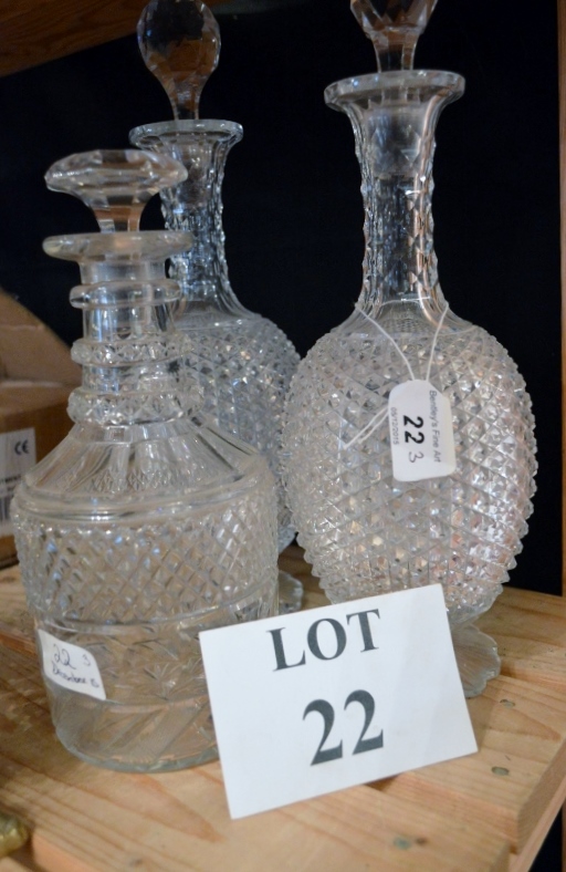 A pair of 19th century cut glass decanters and a mallet shaped decanter (stoppers associated) est: