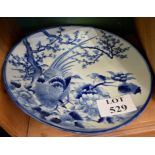 A 19c large blue and white Chinese charger decorated with a peacock (slight hairline) est: £60-£80