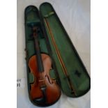 A wooden cased violin est: £30-£50 (J)