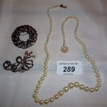 A graduated individually knotted pearl necklace with 9ct gold pearl clasp (approx 9" long) and two