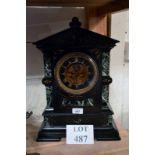 A late Victorian black and green marble mantel clock with striking movement (key and pendulum with