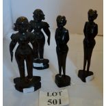 Four carved wooden figures,