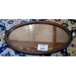 A large oval mahogany tray with glass to